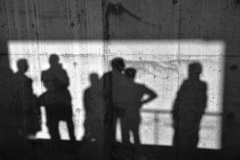 Shadow of crowd on a wall