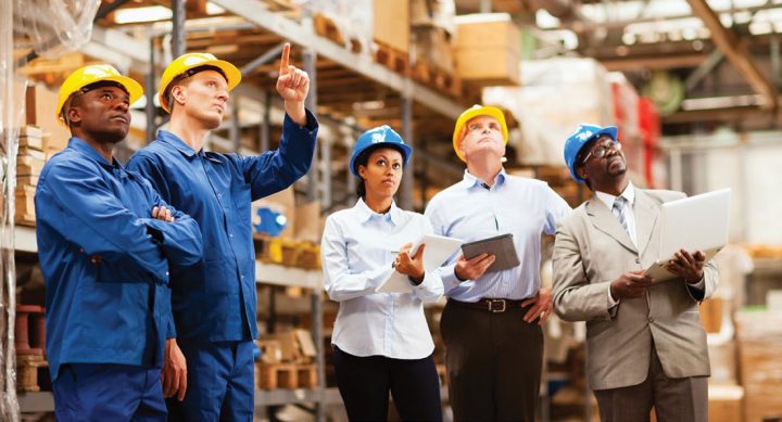 Safety supervisors and workers observing