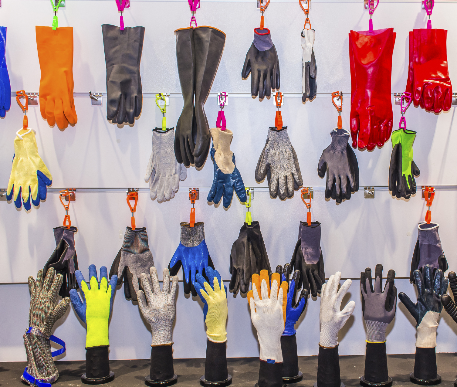 Dry Cleaners Employee Hands In Rubber Protective Gloves Removing