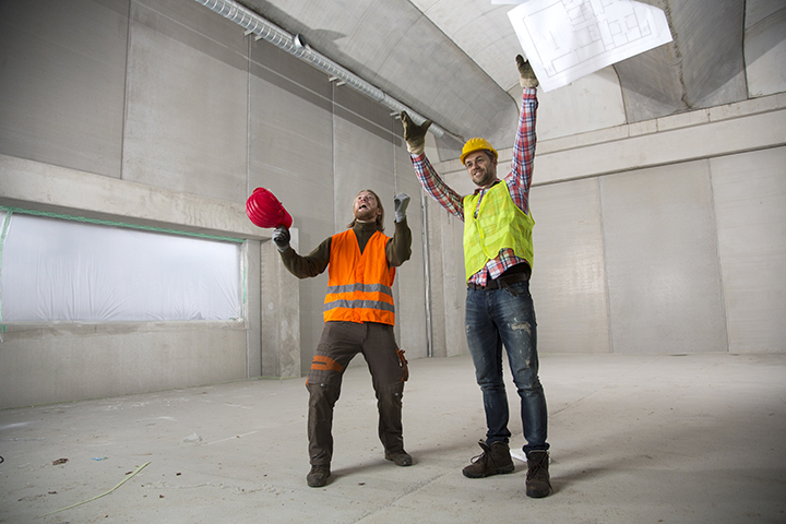 Workers celebrating the end of a project