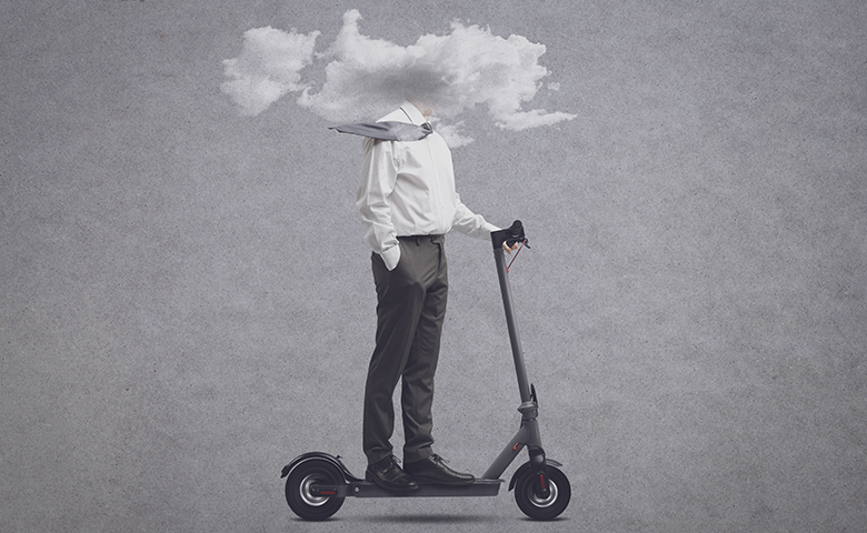 Businessman with head in a cloud symbolizing brain fog