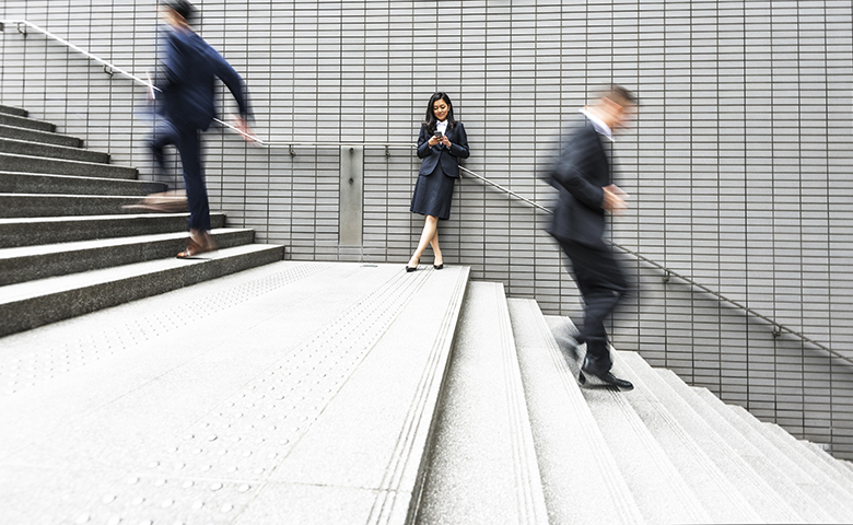 Business people rushing on stairs.