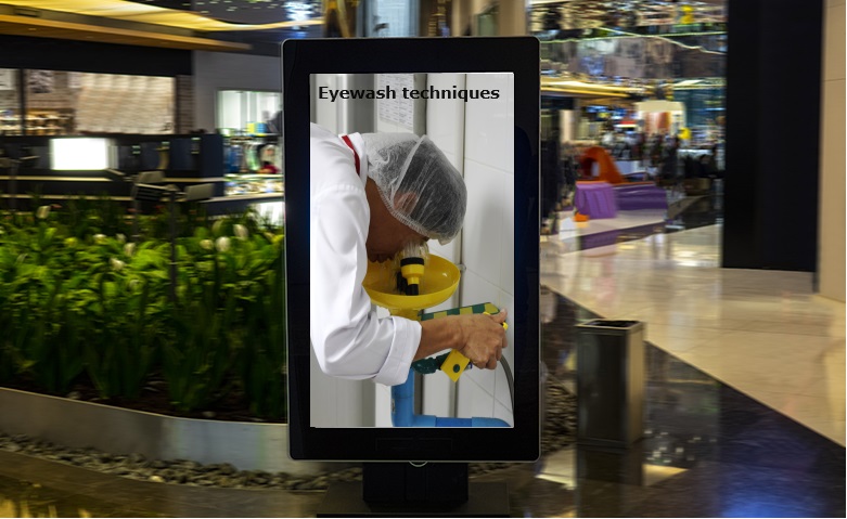 Digital display in the workplace with an eyewash presentation on the screen