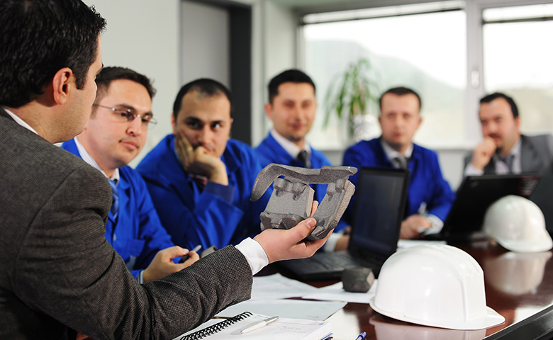 Man telling a story with a prop specific to the job site