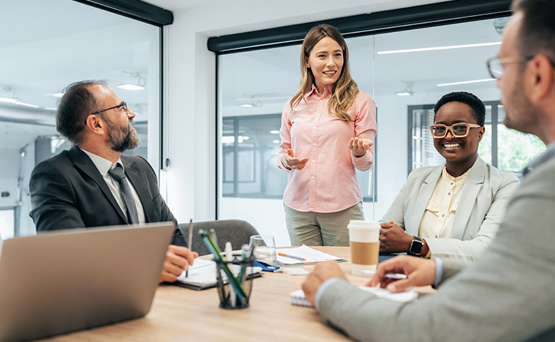 Woman engaging her coworkers in conversation