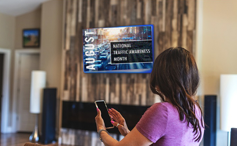 Woman looking at August digital display in her workplace