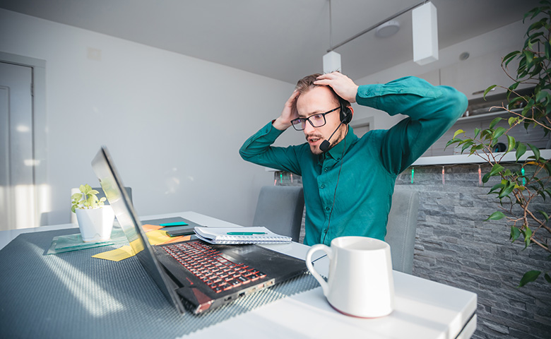 Man stressed by error on computer