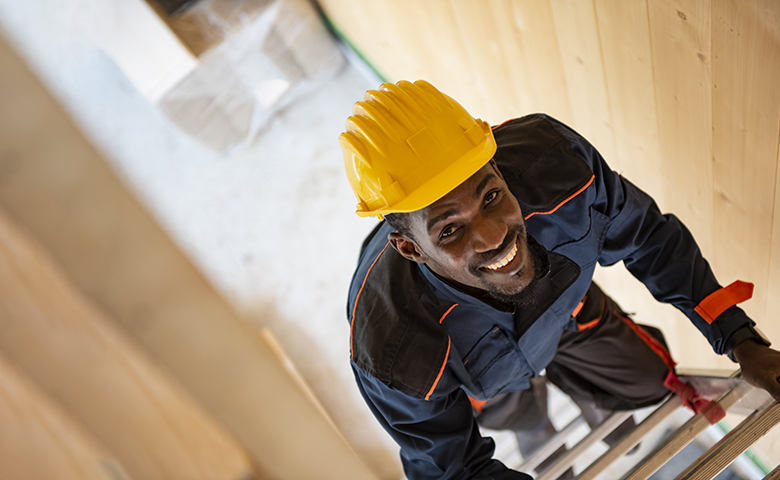 Construction worker on ladder