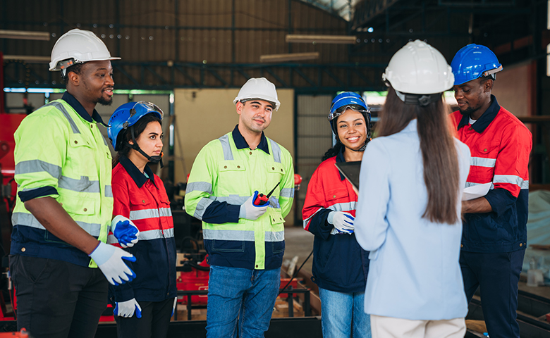 New and young workers in manufacturing industry receiving onboarding