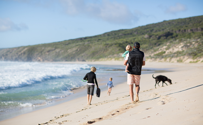 Family and dog on the beach
