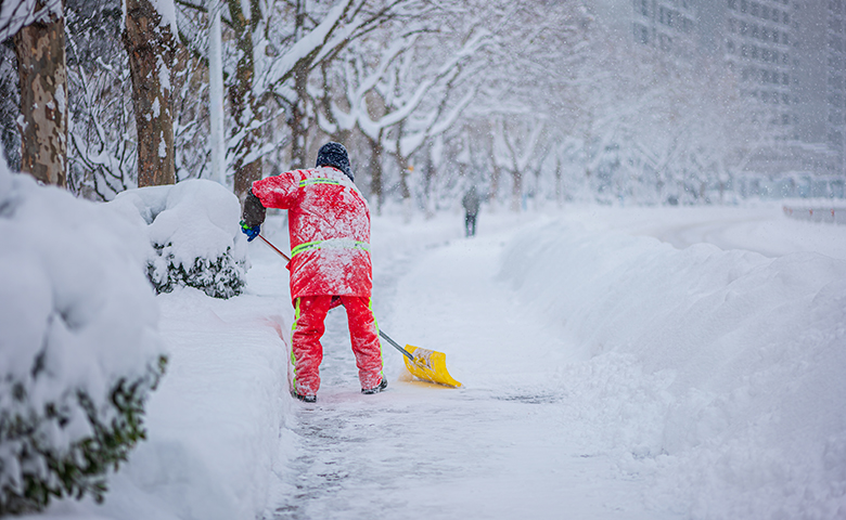Worker clearing snow in the dead of winter