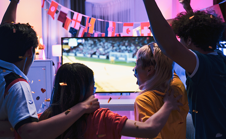 A group of people watching a FIFA World Cup match