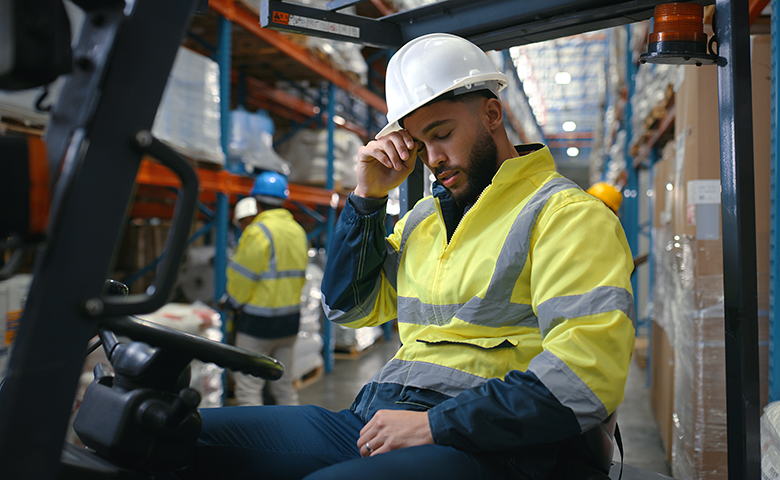 Worker fatigued on forklift