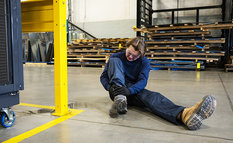 Worker slipped on water on the warehouse floor